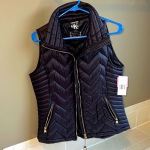 Never worn with tags. Size small Calvin Klein puffer vest